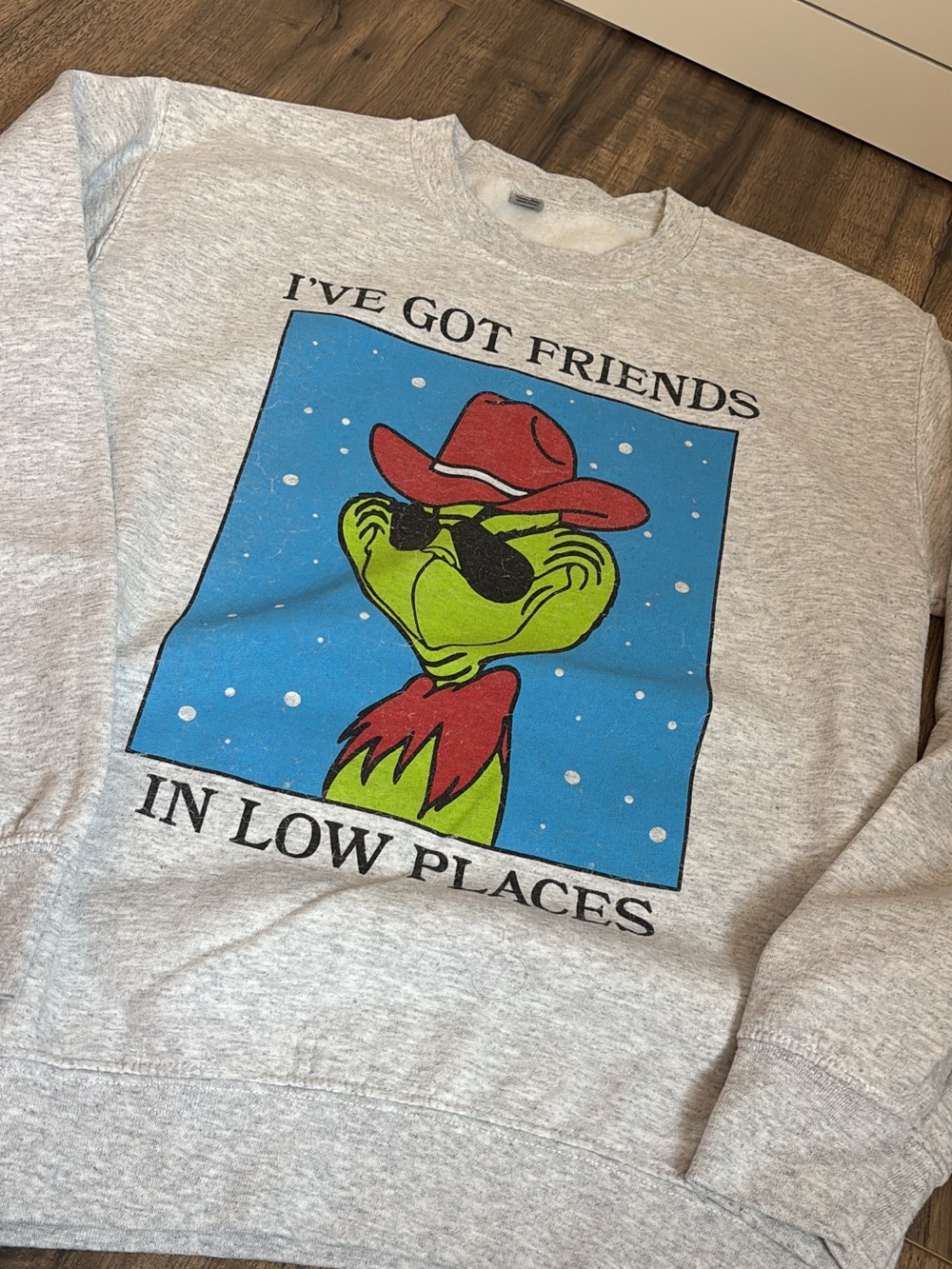 Gildan Heather Gray Sweatshirt with Green Grinch Graphic and Red Hat
